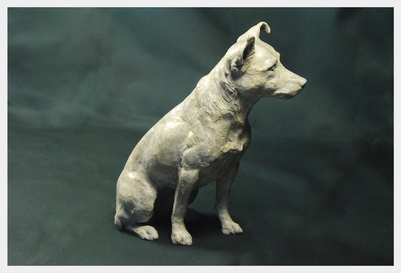Realistic bronze sculpture of a Jack Russell Terrier dog alert and ready for action